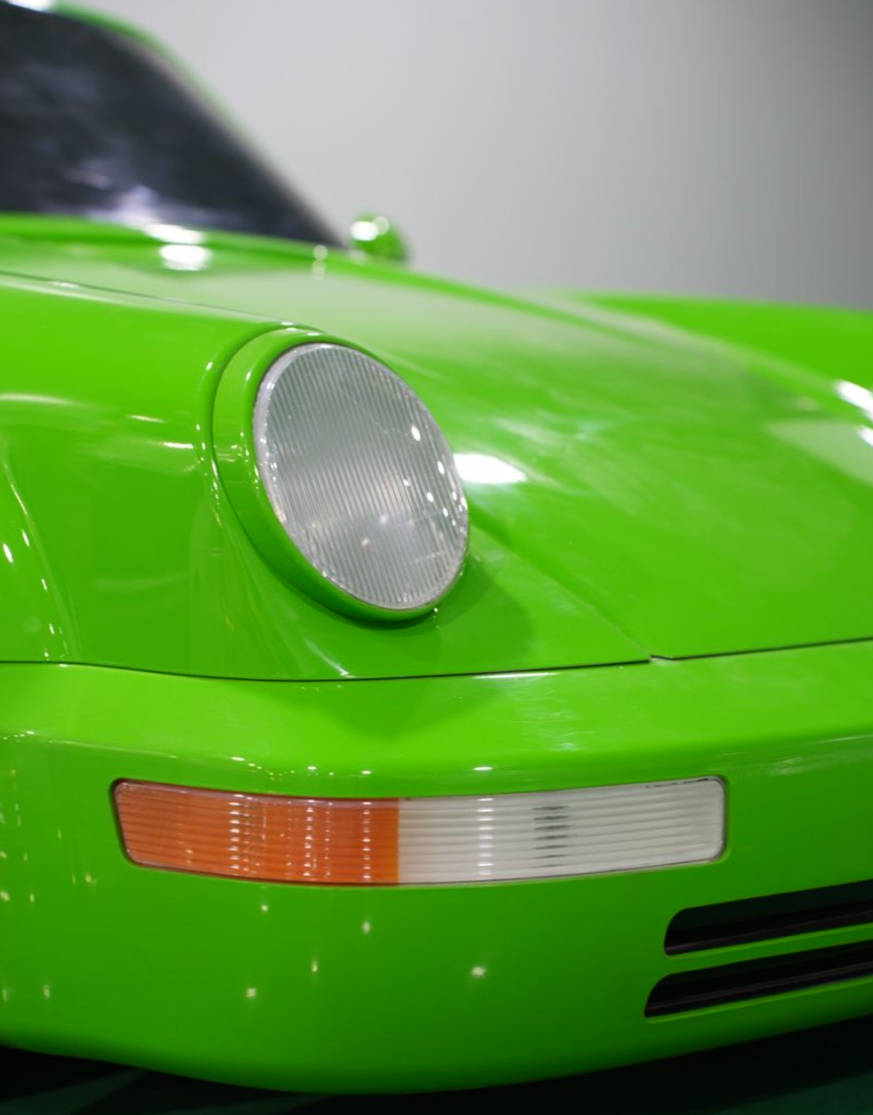 Close-up of classic round headlight and front turn signal
