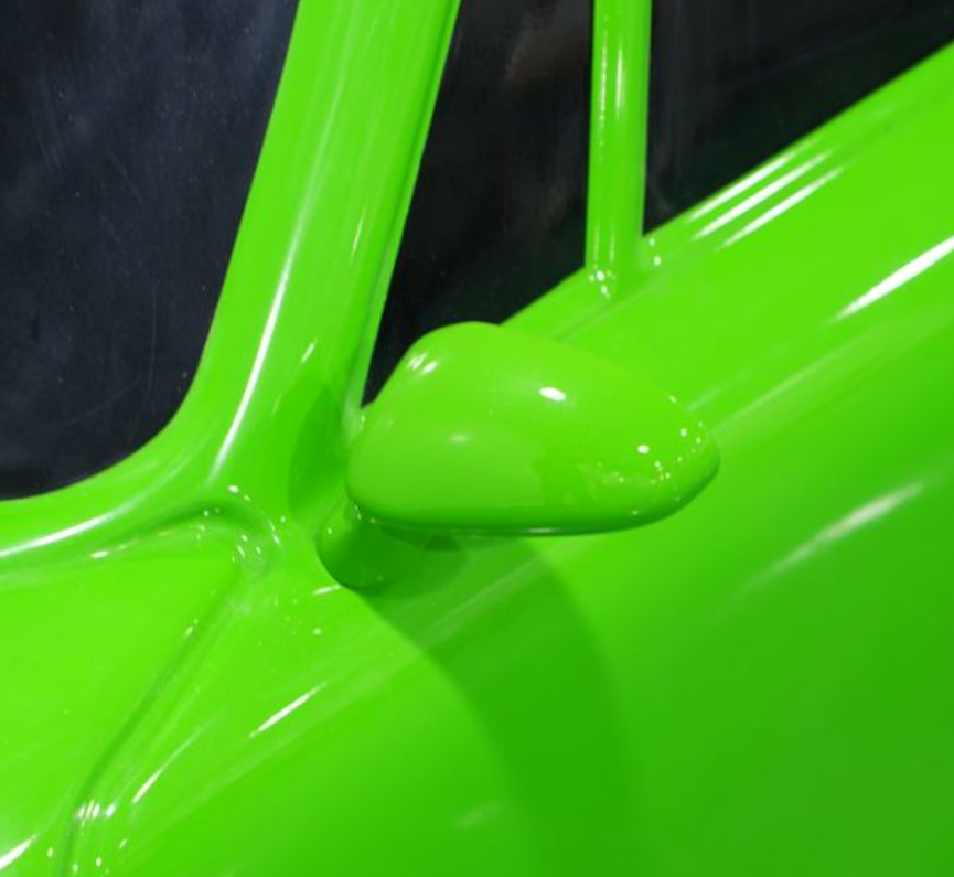 Close-up of opposite side mirror and window line